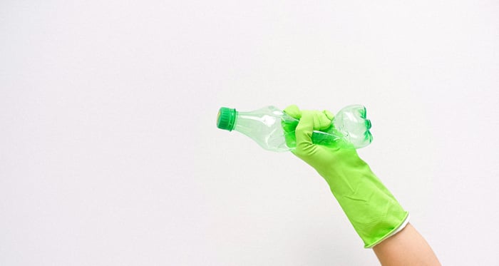 crushing green bottle